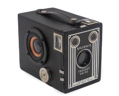 an old brownie target camera on a white background