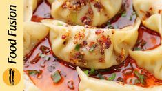 some dumplings with sauce and seasoning on them