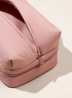 A roomy, double-layered toiletry bag for organizing all your fave makeup and travel goodies (and then some) on the go now in our Find Comfort mauve. Rare Beauty Toiletry Bag, Rare Beauty Puffy Toiletry Bag, Pink Cosmetic Bag With Zipper For Organization, Travel Cosmetic Storage Pouch With Zipper Closure, Functional Cosmetic Pouch With Zipper Closure, Travel Cosmetic And Toiletry Pouch With Zipper, Blush Rectangular Travel Bag, Functional Cosmetic And Toiletry Storage Pouch With Zipper, Pink Functional Cosmetic Bag With Removable Pouch