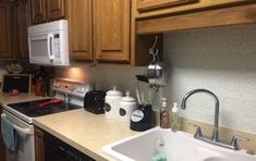 the kitchen is clean and ready for us to use in its new owner's home