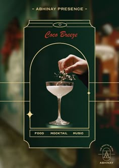 an advertisement for a cocktail bar with a hand placing flowers in the martini glass on top