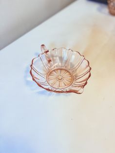 a glass bowl sitting on top of a table