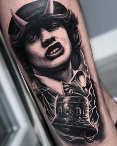 a man's leg with a black and white photo of him on the cover up