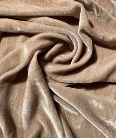 a close up view of a brown velvet fabric