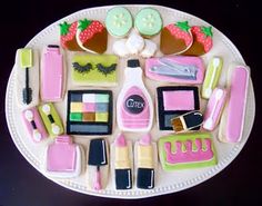 there are many different items on the plate together, including lipstick, nail polish, and other things