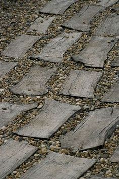 an image of a stone walkway that looks like it is made out of wood