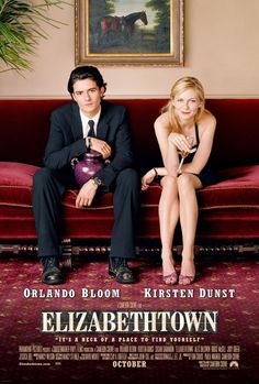 a movie poster for elizabeth town with two people sitting on a couch and one man in a suit