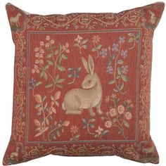 a red pillow with an embroidered bunny on the front and floral design on the back