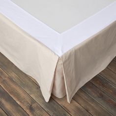 a bed with a white sheet on top of it