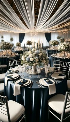 an elegant table setting with white and blue linens