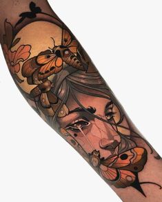 a woman's face with butterflies on her arm