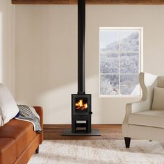 a living room with a couch, chair and fire place in the corner on the floor