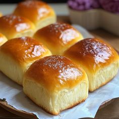 small rolls sitting on top of a paper plate