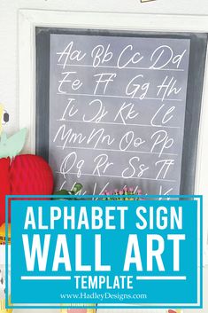 the alphabet sign wall art is displayed in front of a chalkboard with writing on it