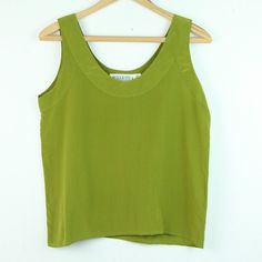 Vintage 90s Autograph 100% silk green tank top size small. It has two small spots on front, one on neckline and one lower down towards hem. Please see all photos for condition and check the measurements for size. Chest 38" Length 22" 106 Office Green, Green Tank Top, Green Tank, Favorite Things Gift, Womens Clothing Tops, Labour Day, Vintage 90s, Vintage Ladies, Blouses For Women