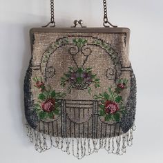 Antique beaded bag, handmade of micro glass beads, a beautiful floral motif. The closure and the chain are made of brass.  French work from the beginning of the XXth century, Art Deco period. Dimensions:  Length with chain: about 36 cm / 14" Length of bag: 34 cm / 13.4" Width: 19 cm / 7.4" In very nice antique condition - very few missing beads, lining is soiled I'm happy to combine shipping costs if you buy more than one item. Import duties, taxes, and charges are not included in the item price Traditional Handmade Bags For Vintage Events, Art Deco Bags Vintage Purses, Seed Bead Purse, Antique Beaded Wedding Bag, Art Deco Clutch, Vintage Evening Bag With Gold Beads, 1920s Accessories, Luxury Vintage Beaded Shoulder Bag, Antique Beaded Evening Bag