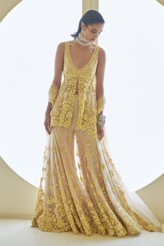 Shop for these amazing collections of Yellow Net Embroidery Sequins Deep V Flower Peplum Tunic Sharara Set For Women by Seema Gujral online at Aza Fashions. Sangeet Board, Floral Sharara, Mirror Lehenga, V Flower, Seema Gujral, Mehendi Outfit, Haldi Outfit, Net Embroidery