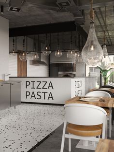 the interior of a pizza restaurant with white chairs and wooden tables in front of an open kitchen