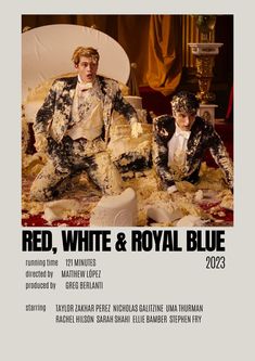 two men sitting on top of a white couch in front of a red, white and royal blue poster