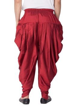 Vastramay brings to you this Stylish yet Comfortable Men Maroon Men Cotton Art Silk Cowl Design Patiala Style Dhoti Pant. Adorn it for a perfect Classy and Trendy look. Pair it with a juti or a mojari for the Royal look. Product Features :  Top Color: Maroon Bottom Color: Maroon Top Fabric: Cotton Art Silk Bottom Fabric: Cotton Art Silk Blend Product Type: Cowl Design Patiala Style Dhoti Pant Fabric Purity: Blended Weave Pattern: Regular Traditional Harem Salwar Kameez For Festivals, Traditional Eid Bottoms With Drape, Traditional Drape Bottoms For Eid, Festive Dabka Pants For Festivals, Traditional Trousers For Eid, Traditional Festive Harem Pants, Traditional Harem Pants For Festive Occasions, Traditional Harem Pants With Festive Drape, Bollywood Style Festive Bottoms With Traditional Drape