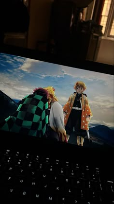 an image of two anime characters on a laptop screen