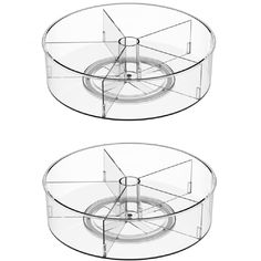 two circular glass tables with wheels on each side and one in the middle, both facing different directions