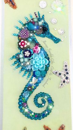 the seahorse is made out of beads and other things on it's side