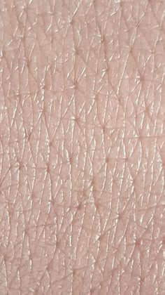 the texture of a woman's skin with light pink and white colors on it