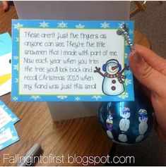 a hand holding a christmas ornament with a poem written on the front and back