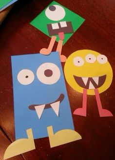 two paper cut outs with cartoon characters on them