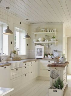 the kitchen is clean and ready to be used for cooking or baking, while also being used as a dining area