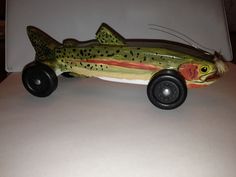 a toy car with a fish painted on it