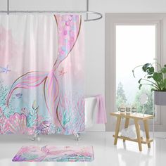 a bathroom with a pink shower curtain and rug