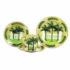 three plates with palm trees on them and one has a cup in front of it