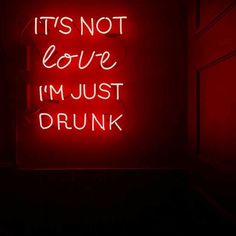 a red neon sign that says it's not love i'm just drunk