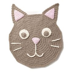 a crocheted cat head is shown on the wall