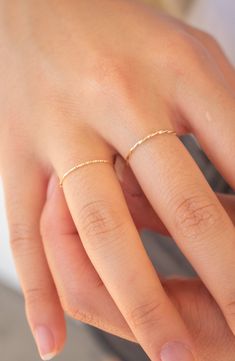 Intricate texturing brings sophisticated charm to a minimalist 14-karat gold ring with stackable versatility. 14k gold Made in the USA Dainty 14k Gold Stackable Rings With Open Band, Minimalist Yellow Gold Stackable Toe Rings, Minimalist Yellow Gold Toe Stackable Rings, Modern Yellow Gold Delicate Jewelry, Dainty Stackable Yellow Gold Midi Rings, Dainty Yellow Gold Stackable Midi Rings, Elegant Hammered Stackable Rings In Recycled Gold, Simple 14k Gold Stackable Rings Tarnish Resistant, Dainty 14k Gold Stackable Toe Rings