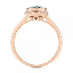 Rose Gold Diamond and London Blue Topaz Fashion Ring - Finger Through View Luxury Light Blue Rings With Accent Stones, Aquamarine Diamond Ring With Halo Setting For Formal Events, Luxury Blue Topaz Halo Ring, Luxury Light Blue Round Ring, Luxury Light Blue Round Rings, Light Blue Brilliant Cut Fine Jewelry Ring, Formal Light Blue Rings With Accent Stones, Luxury Blue Topaz Ring With Center Stone, Formal Aquamarine Rings With Halo Setting