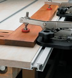 a pair of woodworking tools sitting on top of a piece of workbench