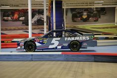 a race car is on display in the garage