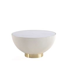 a white bowl sitting on top of a metal stand with a gold base and bottom