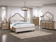 a bedroom scene with focus on the bed and dresser