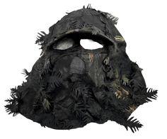 a black mask with spikes and holes on the face is shown in front of a white background