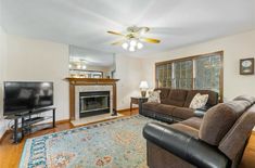 a living room filled with furniture and a fire place