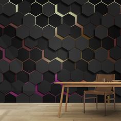 a dining room with a table and chairs in front of a black hexagonal wall