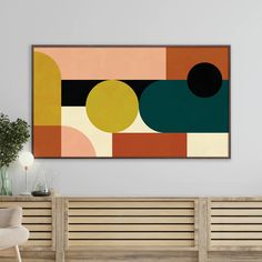 an abstract painting hangs on the wall above a wooden bench in a modern living room