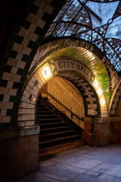 the entrance to city hall is lit up at night