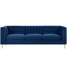 a blue velvet sofa with gold legs and arm rests on an isolated white background,