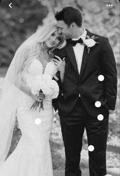 a bride and groom standing next to each other