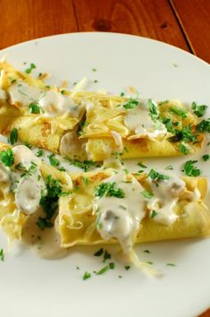 some food is on a white plate with green garnishes and parsley